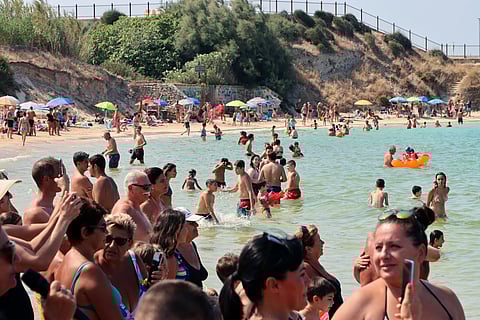 Crowds at a beach in Puglia for summer holidays